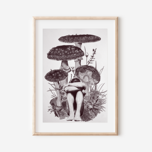 Framed artwork of mushrooms on a white wall