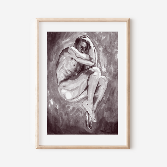 Framed artwork of a nude figure on a white wall