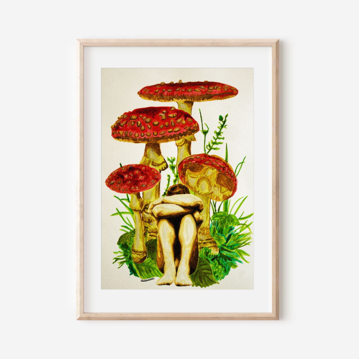 Framed artwork of mushrooms with a person sitting on one, on a white wall.