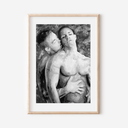 Framed black and white artwork of two nude figures on a white wall