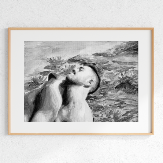 Framed black and white artwork of a woman with flowers on a light gray wall