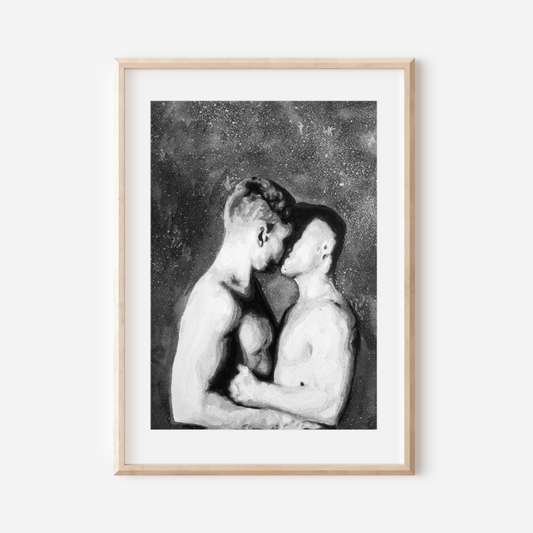 Framed black and white artwork of two people embracing on a white wall.