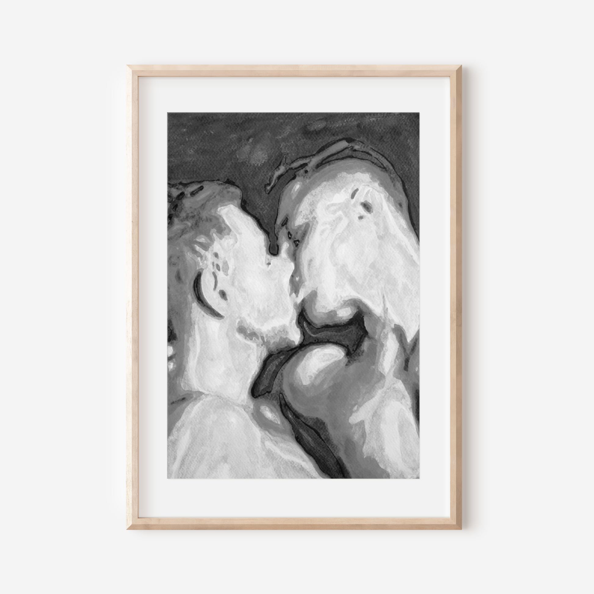 Framed black and white artwork of a couple embracing on a white background