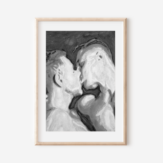 Framed black and white artwork of a couple embracing on a white background