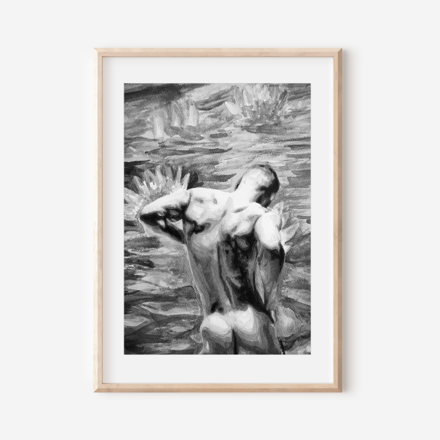 Framed black and white artwork of a nude figure on a white wall