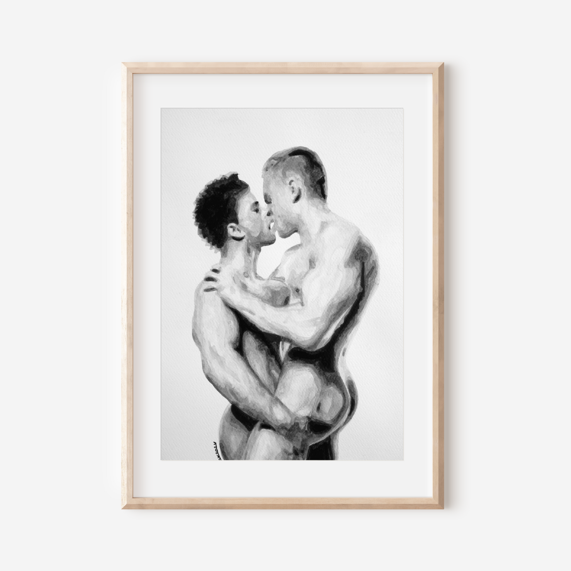 Framed black and white artwork of two men embracing on a white background
