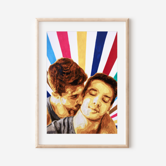 Framed artwork of two people embracing with colorful abstract design in the background