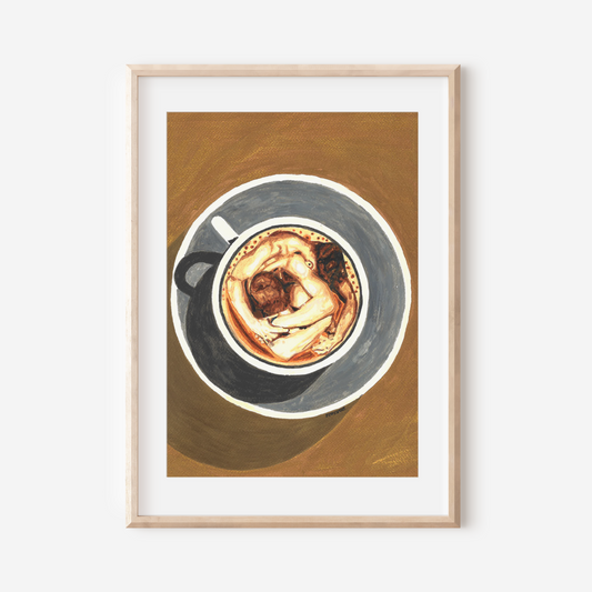 Framed artwork of a coffee cup on a wooden surface