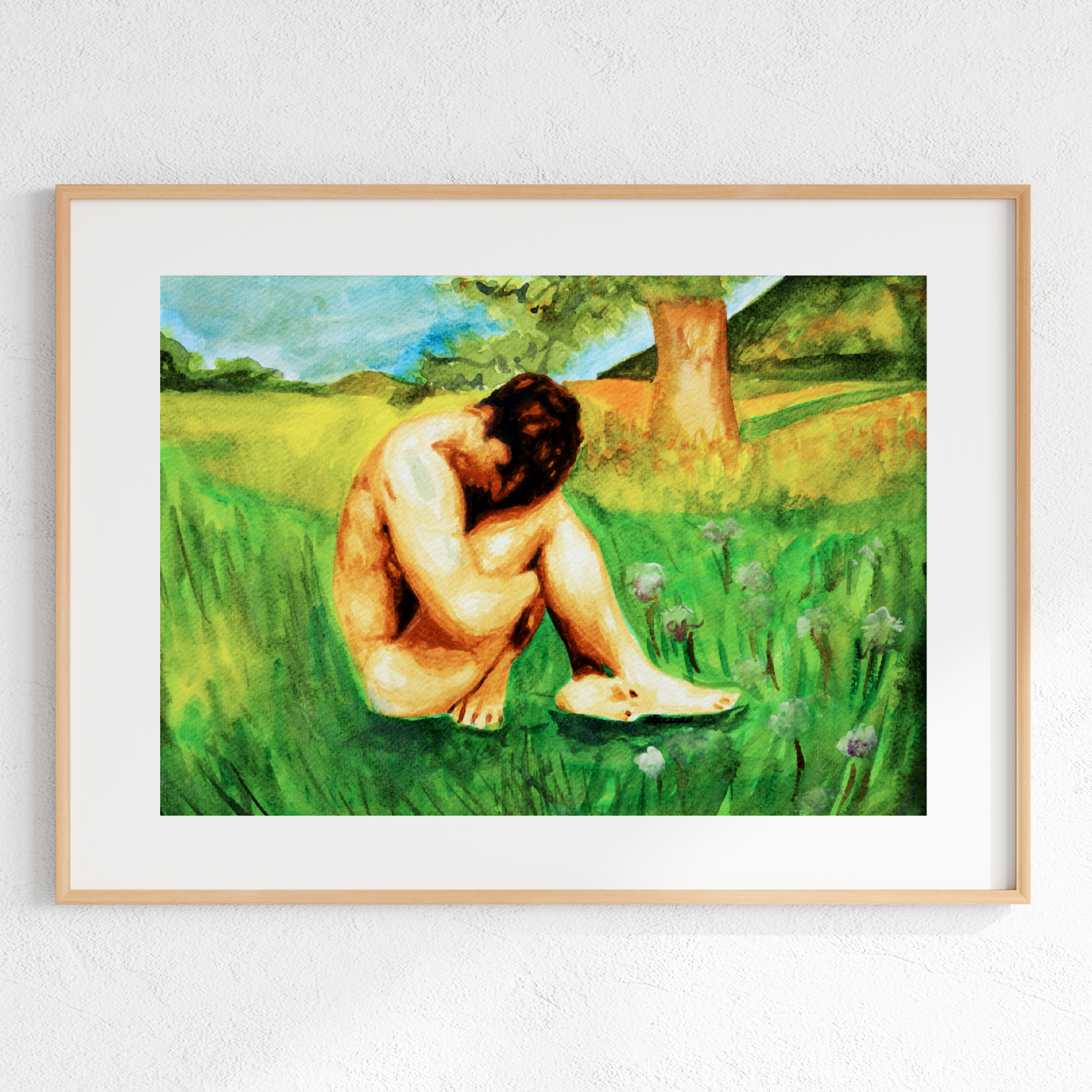 Framed artwork of a nude figure sitting in a grassy field with trees and flowers.