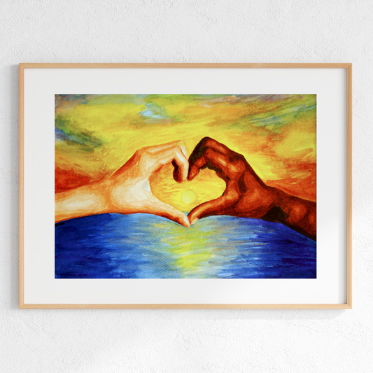 Framed artwork of two hands making a heart shape against a colorful background.