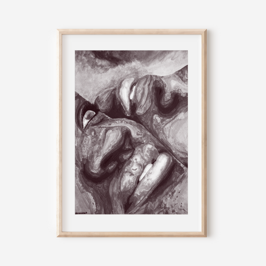 Framed black and white abstract art print on a white wall