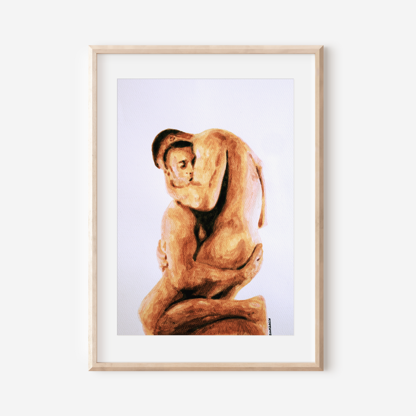 Framed artwork of a nude figure on a white wall