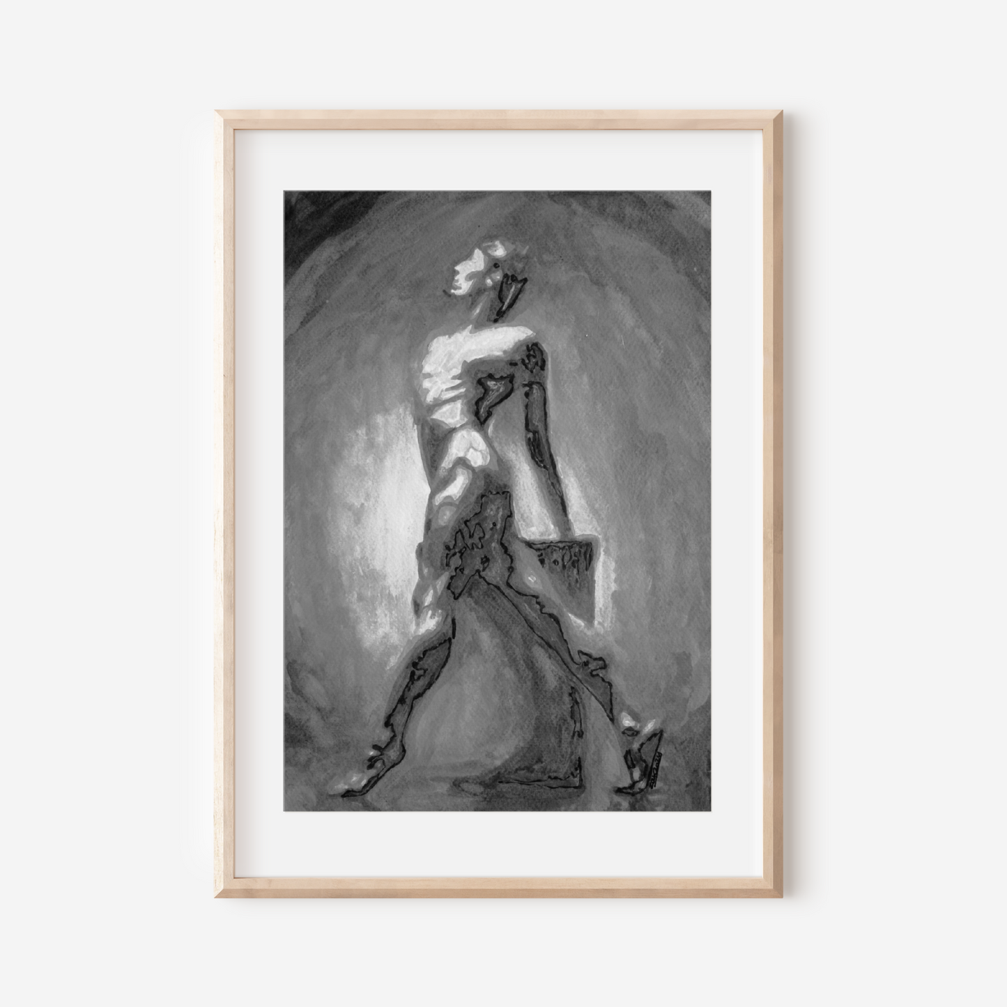 Framed black and white artwork of a dancer on a white wall