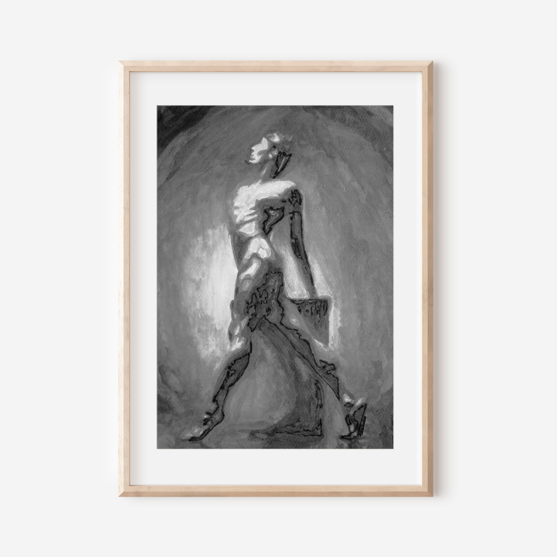 Framed black and white artwork of a dancer on a white wall