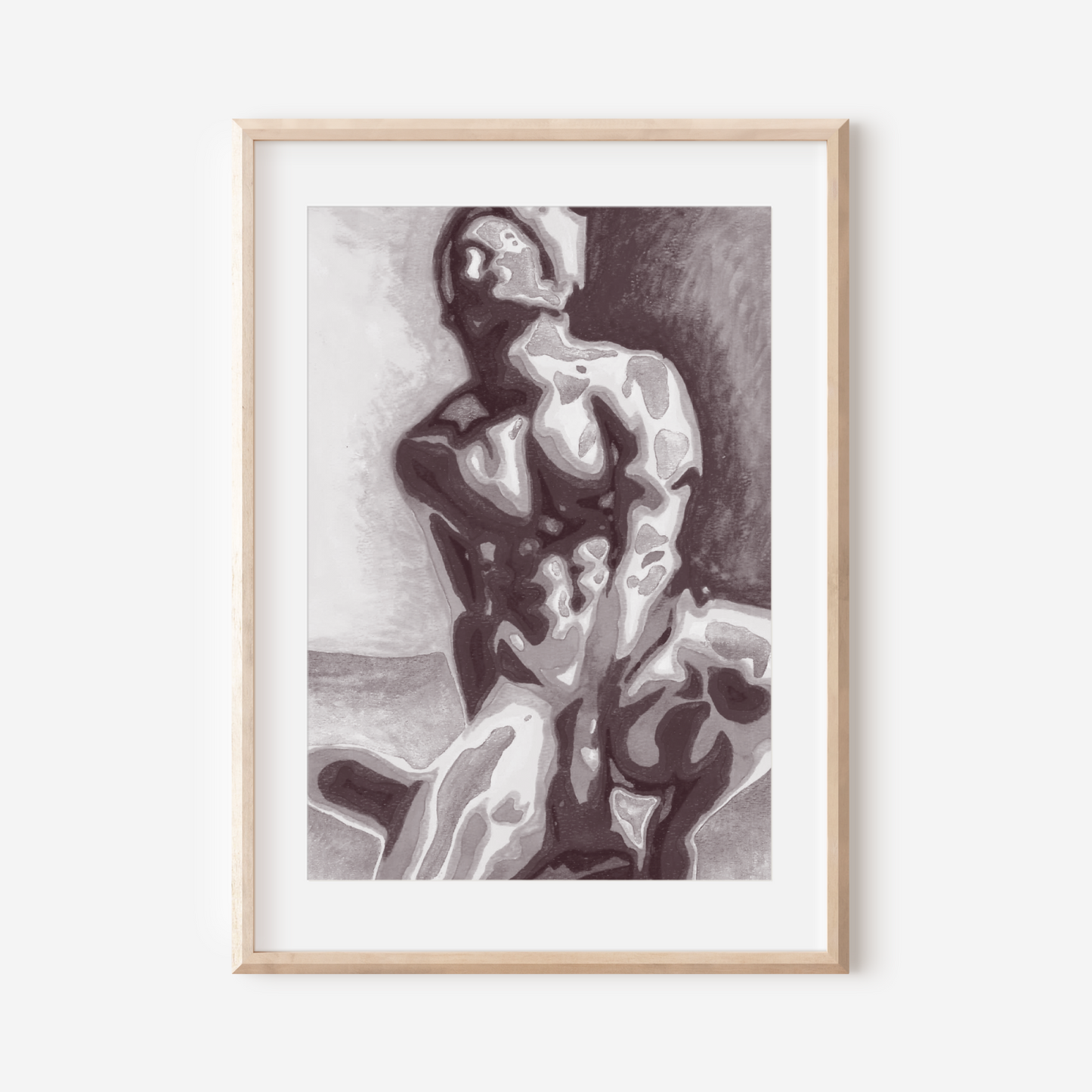Framed black and white artwork of a nude figure on a white wall