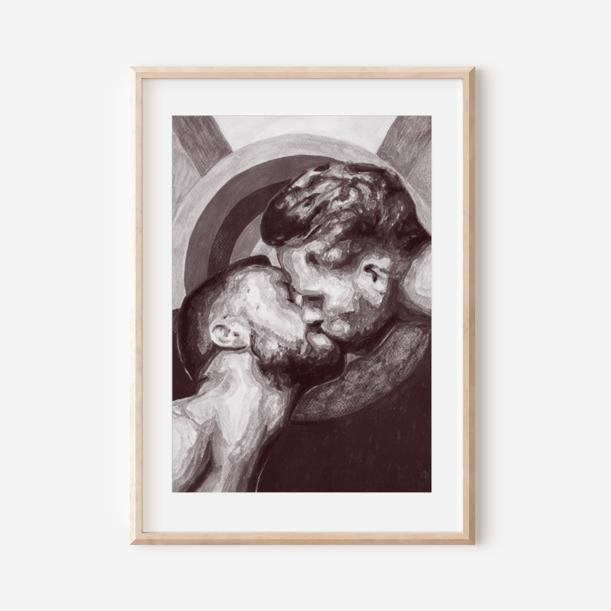 Framed artwork of two people embracing on a white wall