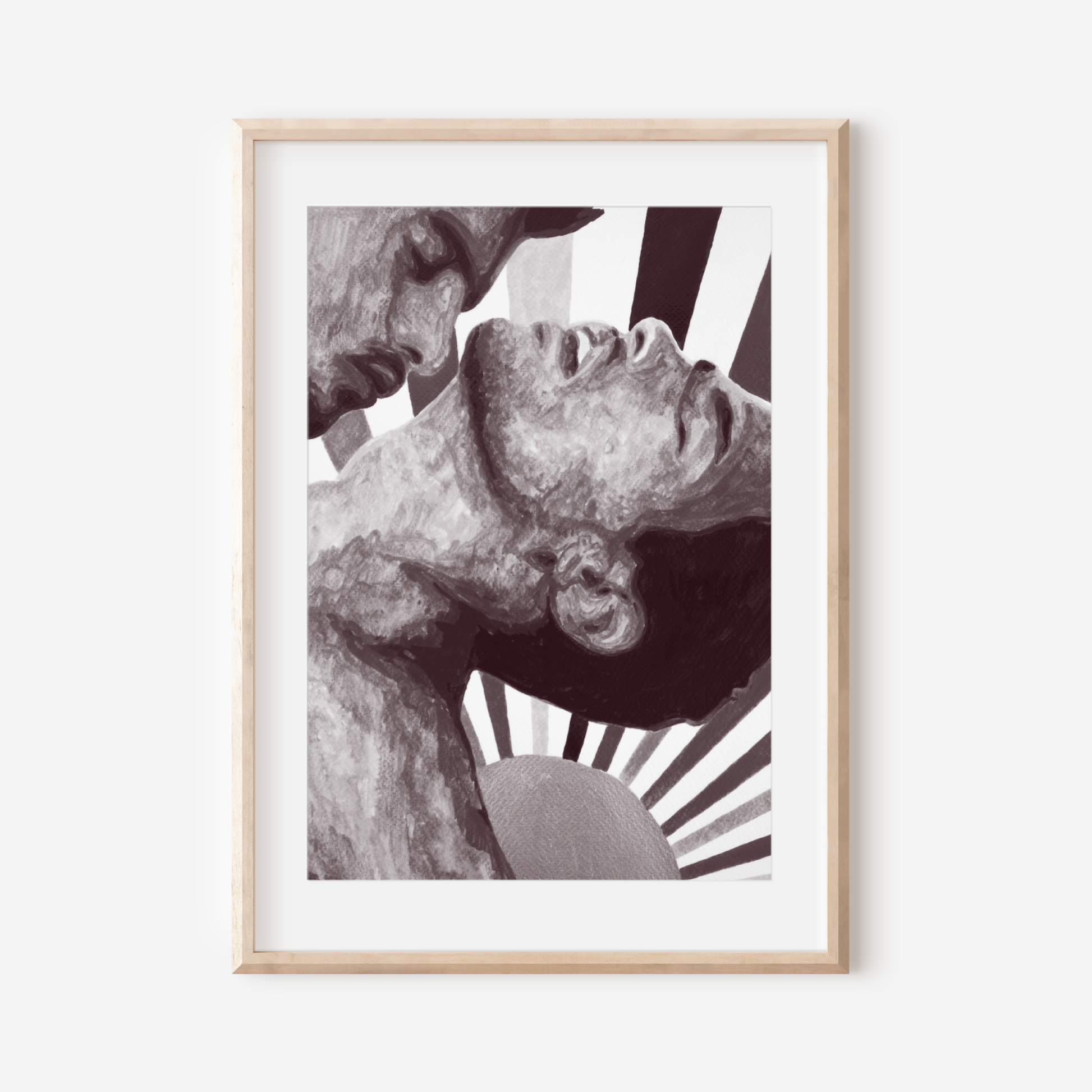 Framed artwork of a black and white abstract design on a white wall