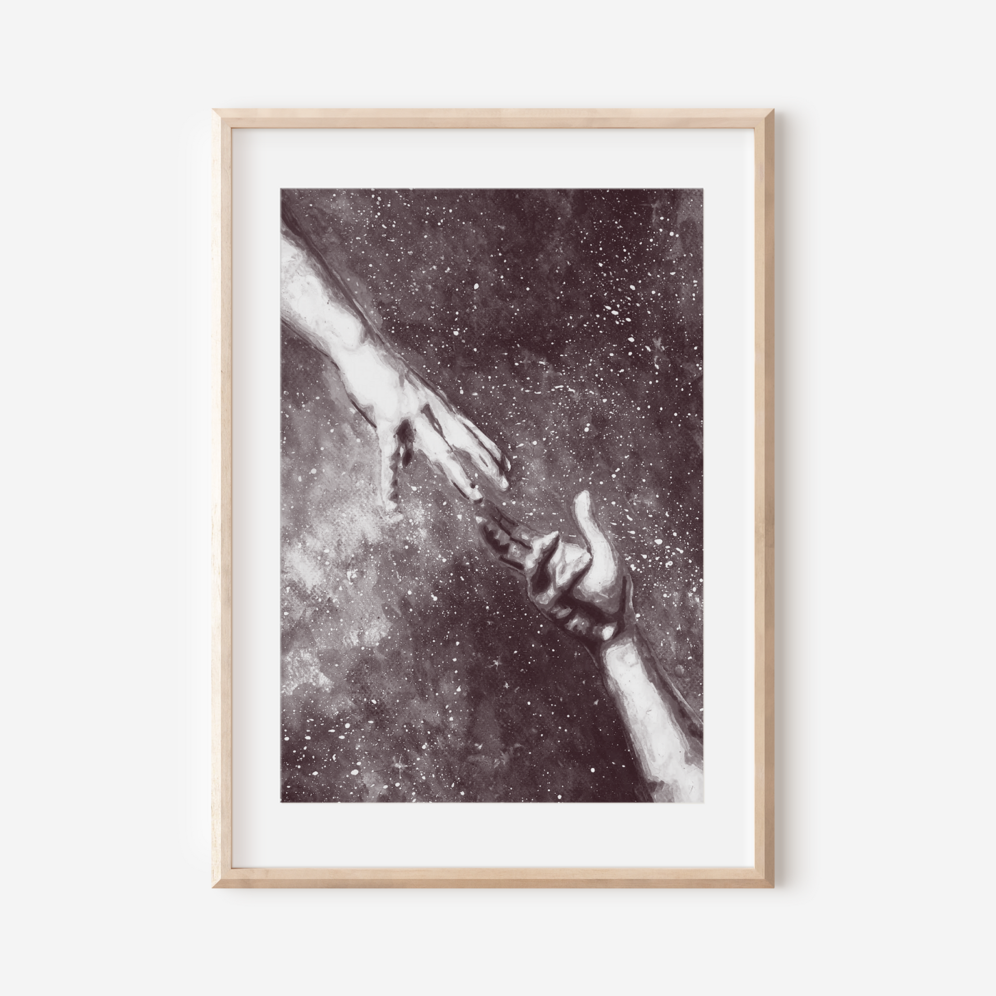 Framed artwork of two hands reaching towards each other against a starry background.