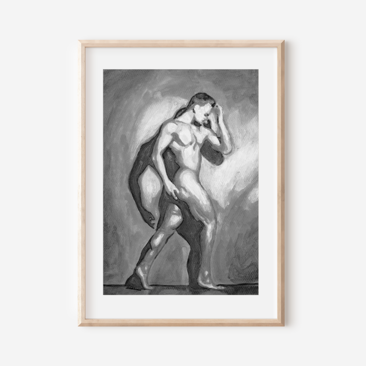 Framed artwork of a nude figure on a white wall