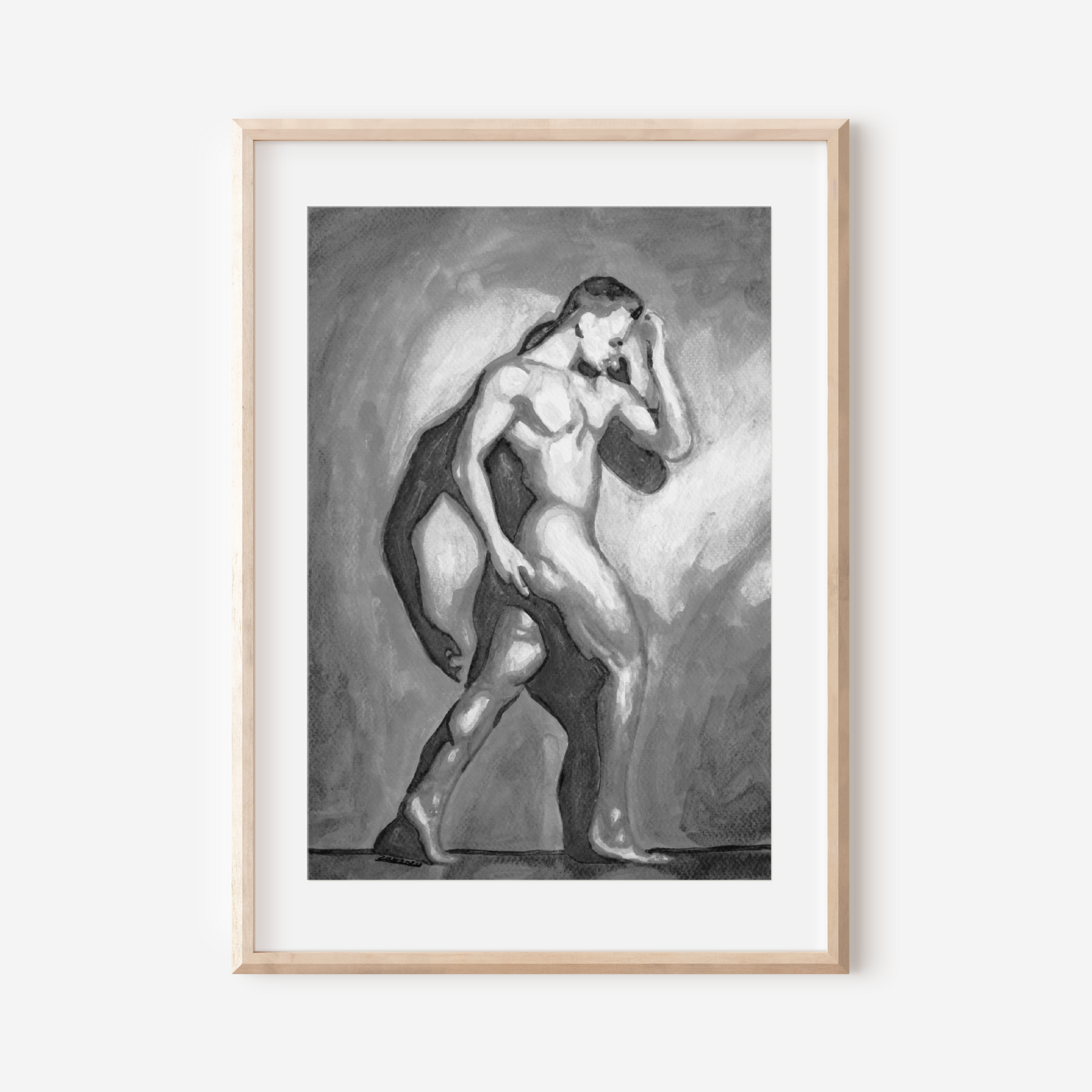 Framed artwork of a nude figure on a white wall