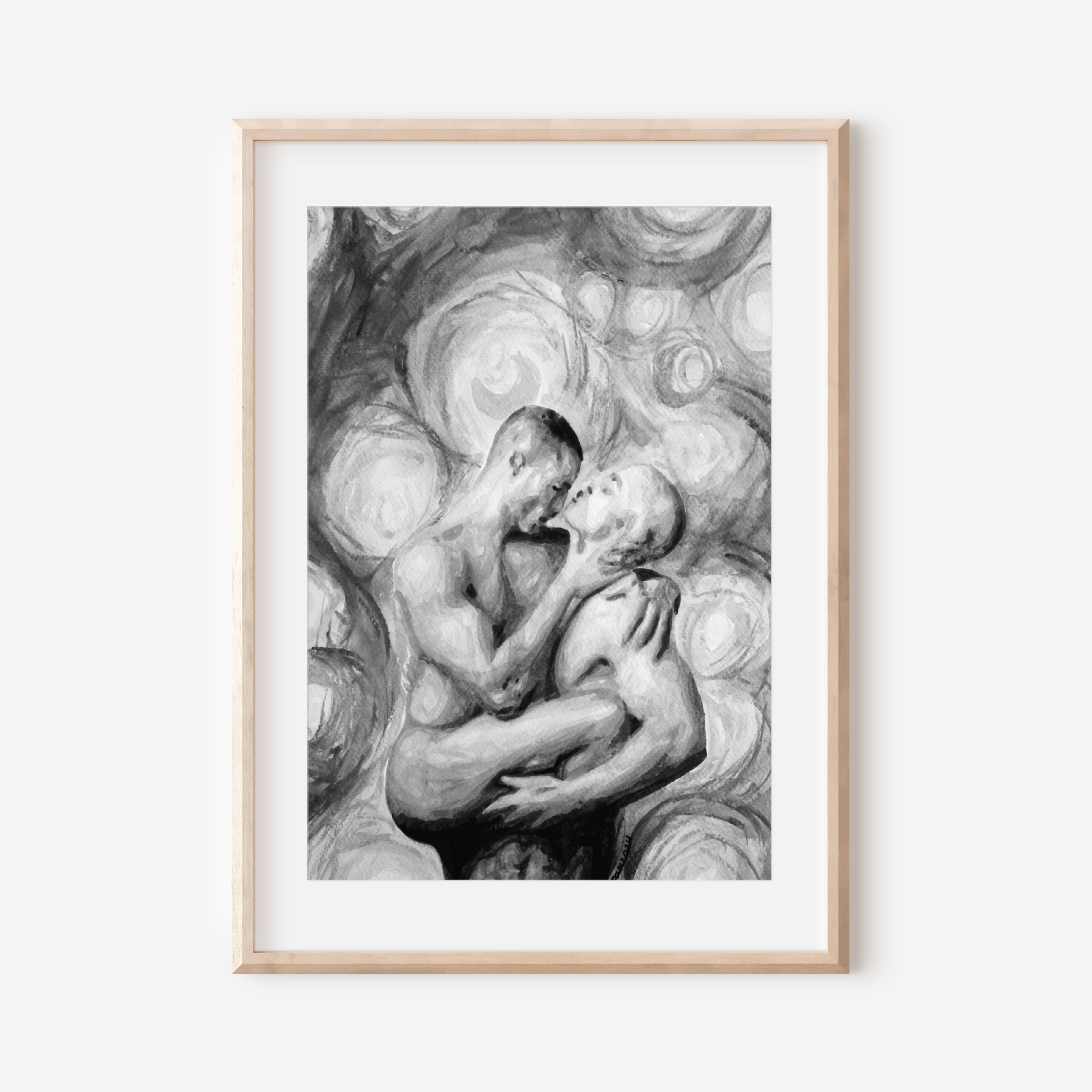 Framed black and white artwork of two people embracing on a white background