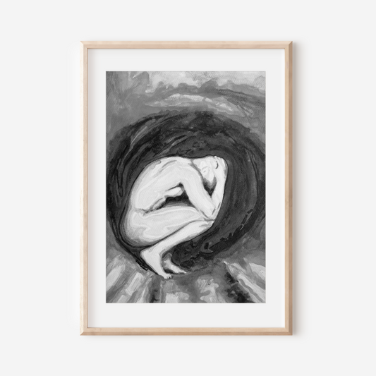 Framed black and white artwork of a woman with her head in her hands on a white background