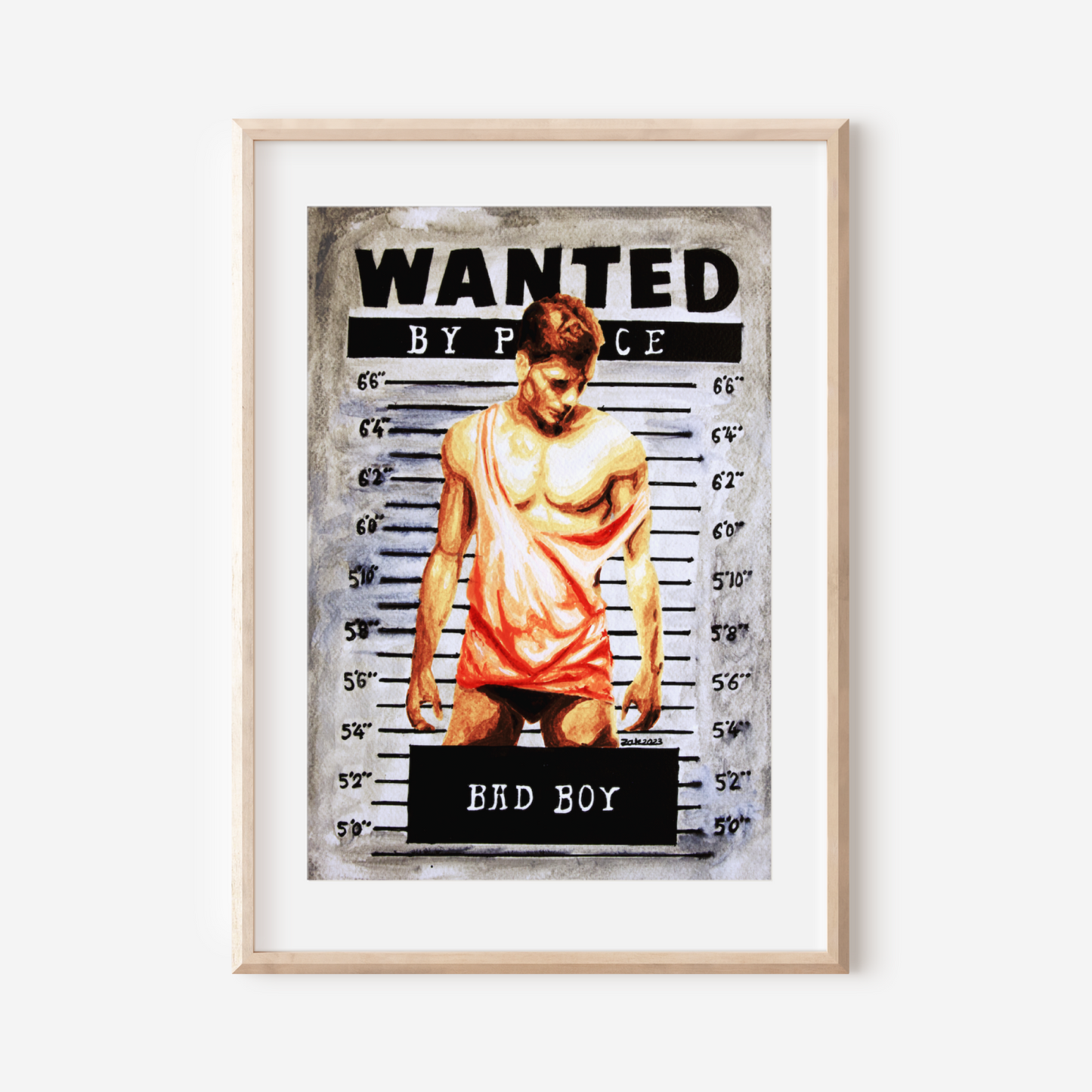 Framed poster with a 'Wanted' design featuring a shirtless person, on a white wall.