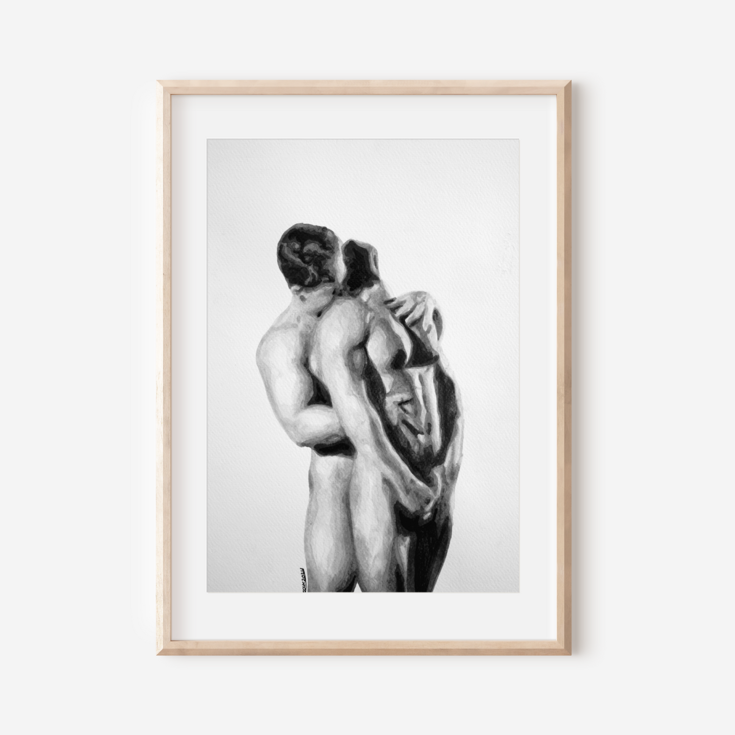 Framed black and white artwork of two nude figures embracing on a white background