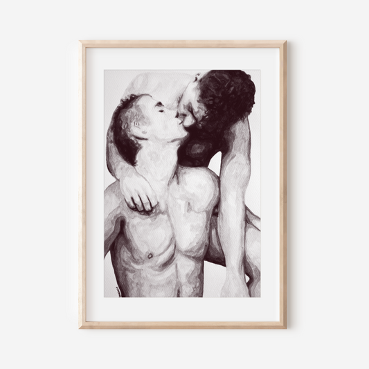 Framed black and white artwork of two nude figures embracing on a white wall.