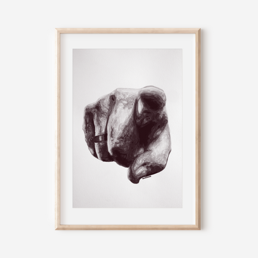 Framed artwork of a dog's head on a white wall