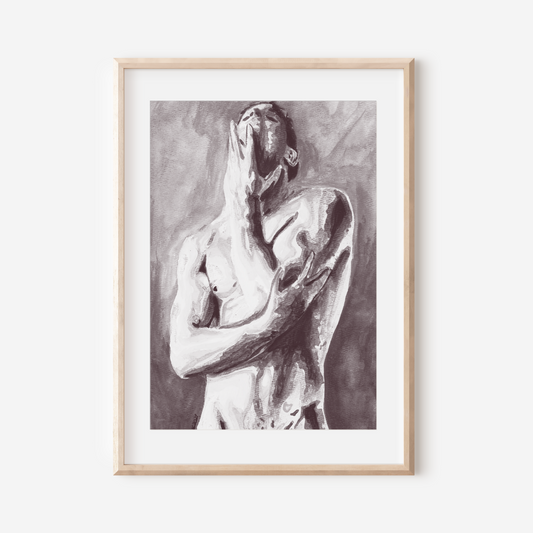 Framed black and white artwork of a nude figure on a white wall