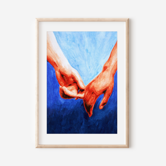 Framed artwork of two hands holding each other against a blue background