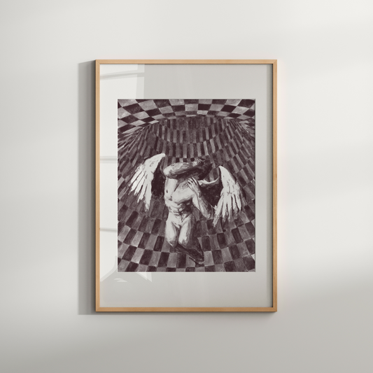 Framed artwork of a black and white abstract design on a light gray wall