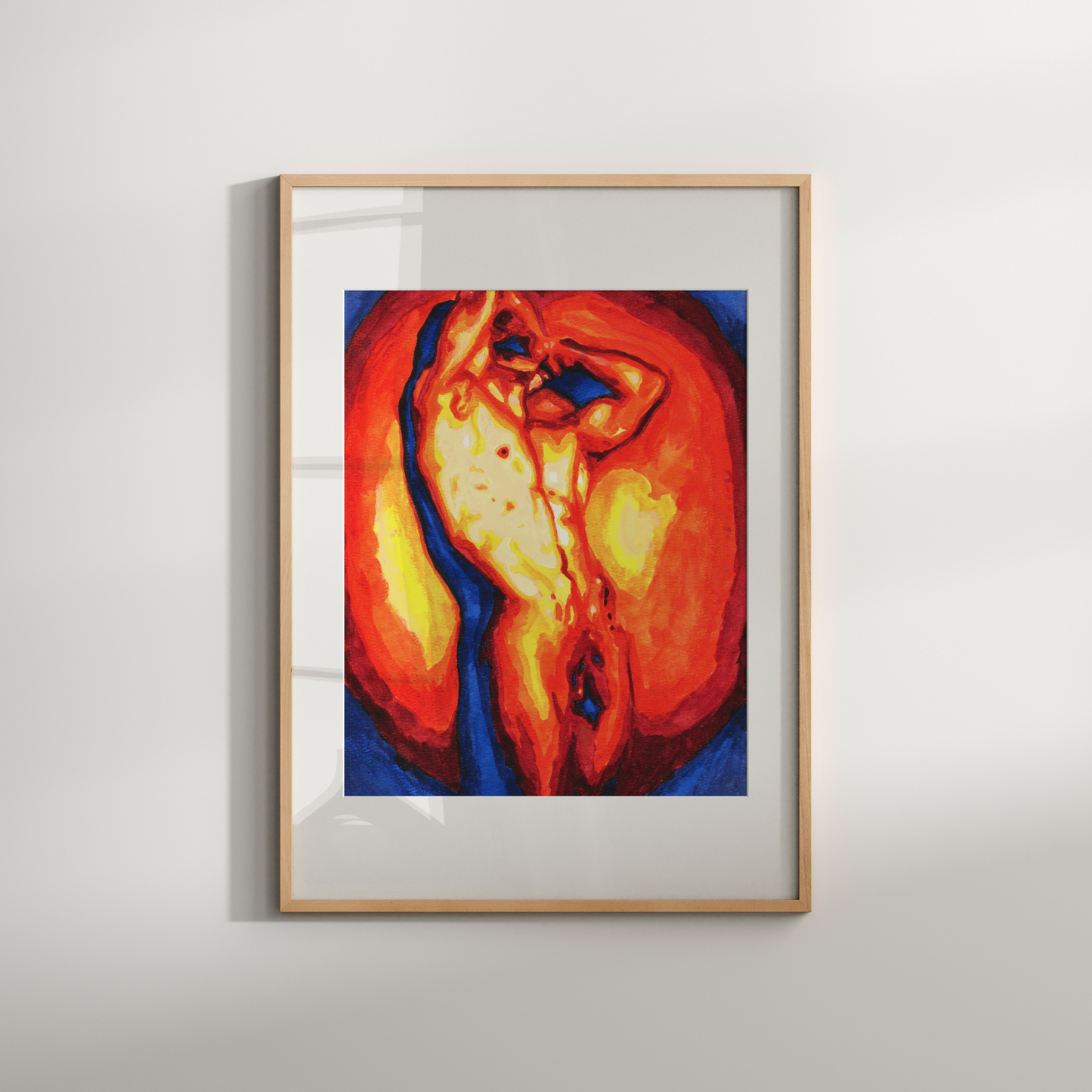 Framed abstract artwork with warm colors on a light gray wall