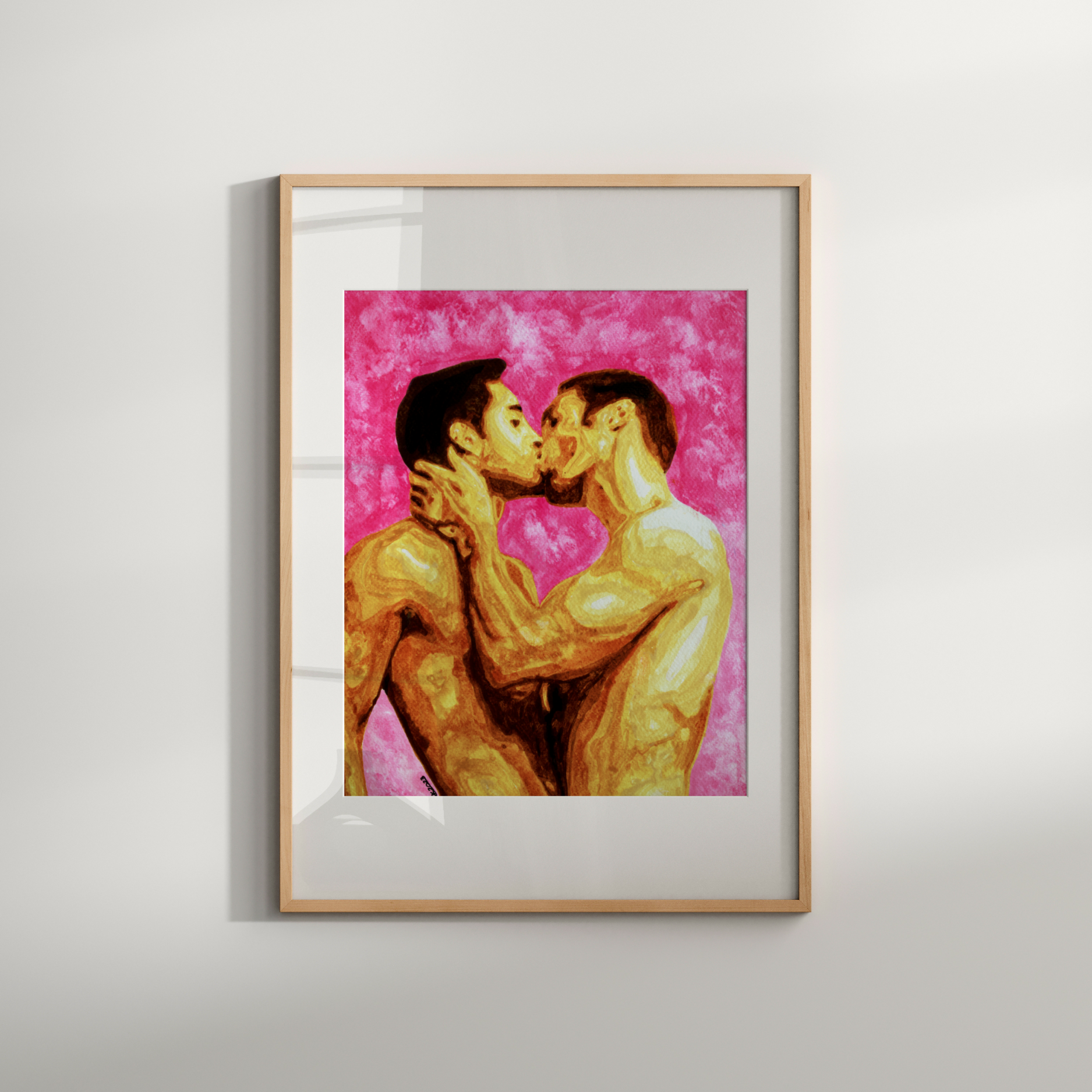 Framed artwork of two people embracing on a pink background