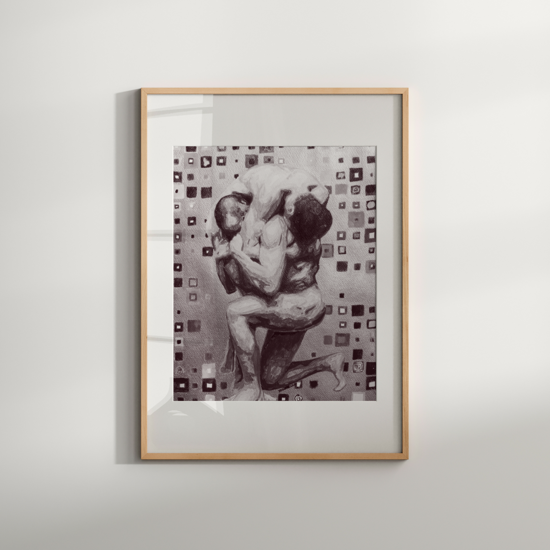 Framed artwork of two people embracing on a light gray background