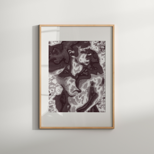 Framed abstract art piece on a white wall