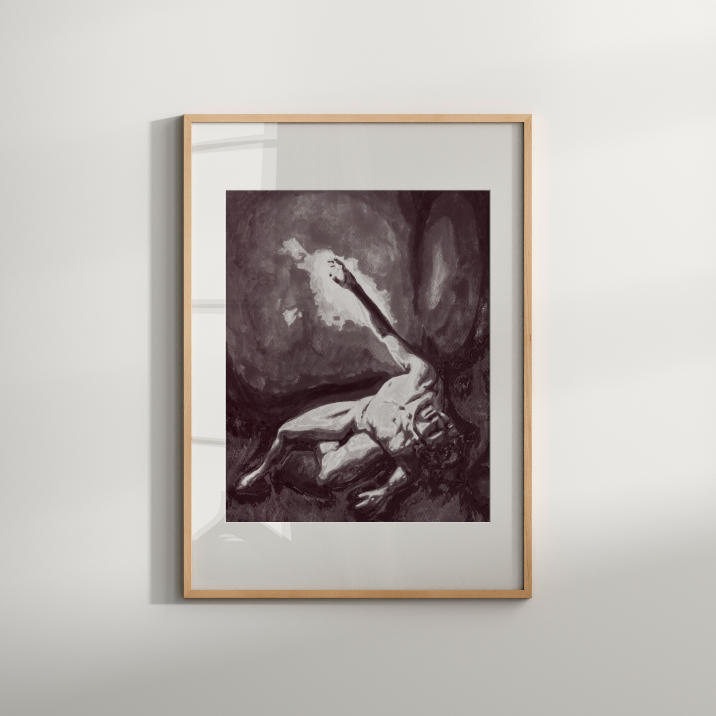 Framed artwork of a nude figure on a plain wall