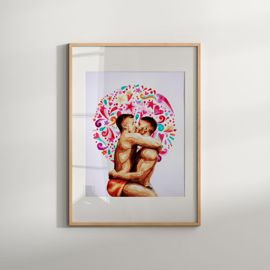 Framed artwork of two people embracing with a colorful heart design on a white wall.
