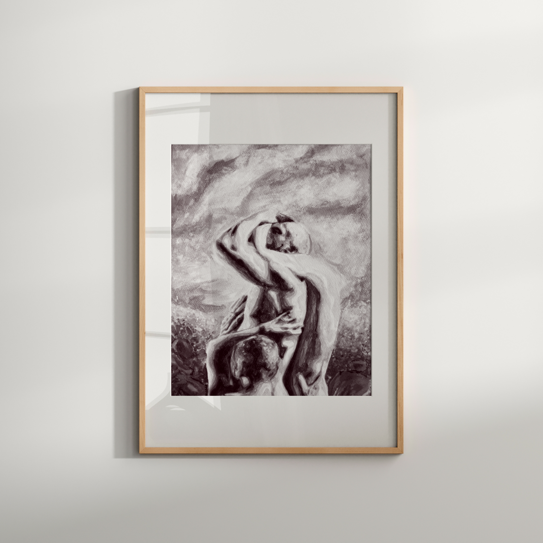 Framed artwork of a nude figure on a white wall