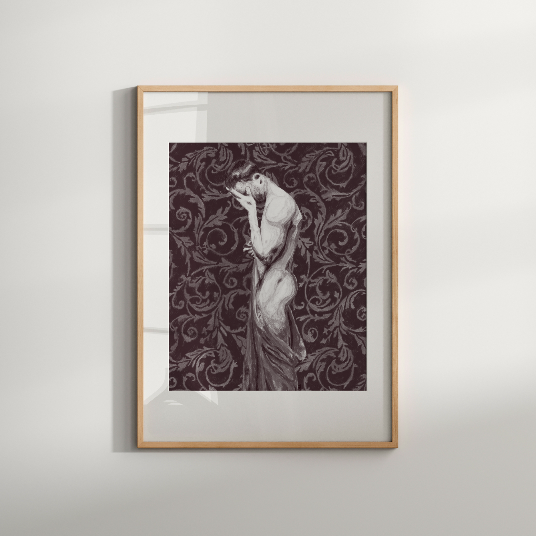 Framed artwork of a woman with intricate patterns on a plain wall
