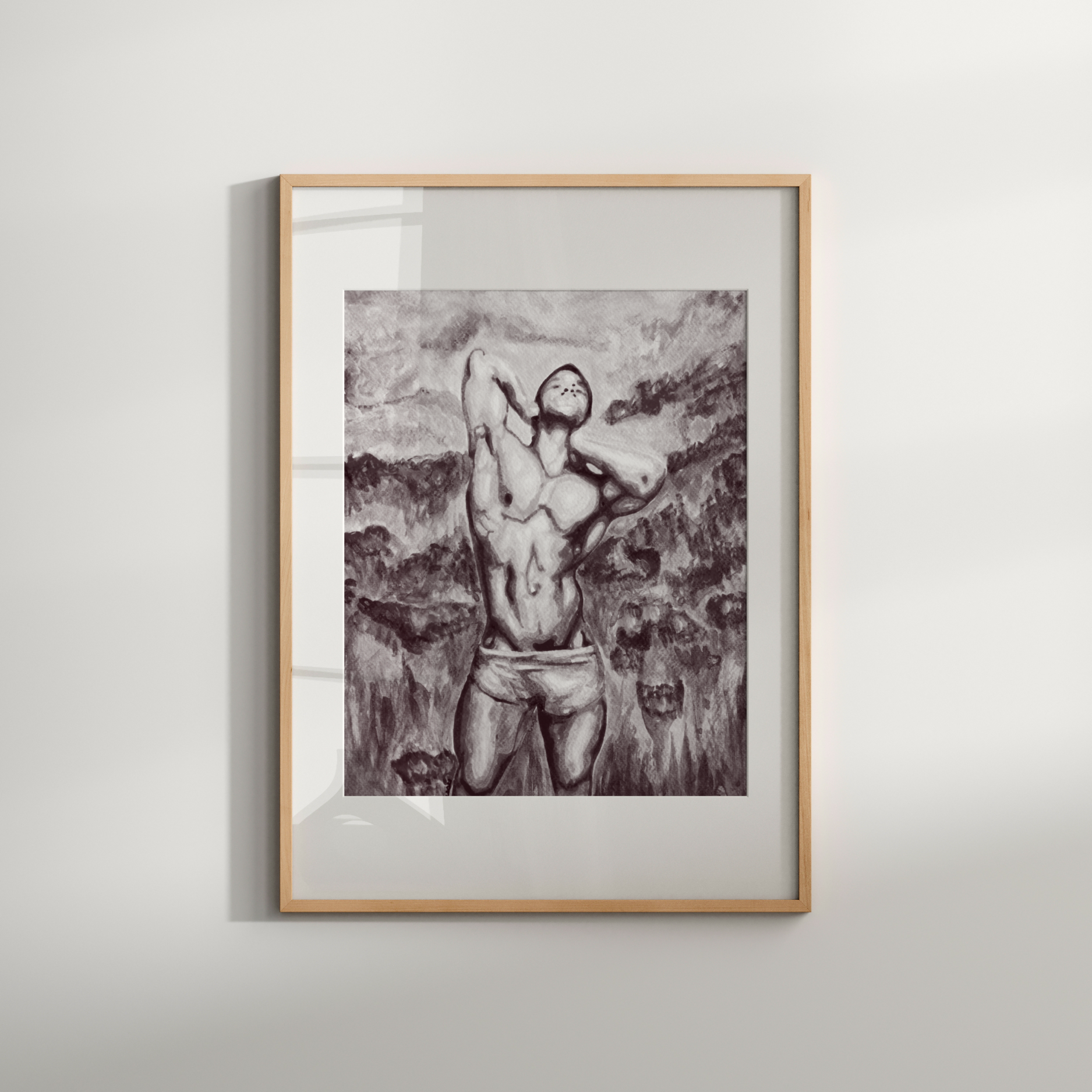 Framed artwork of a nude figure against a mountainous landscape on a white wall.