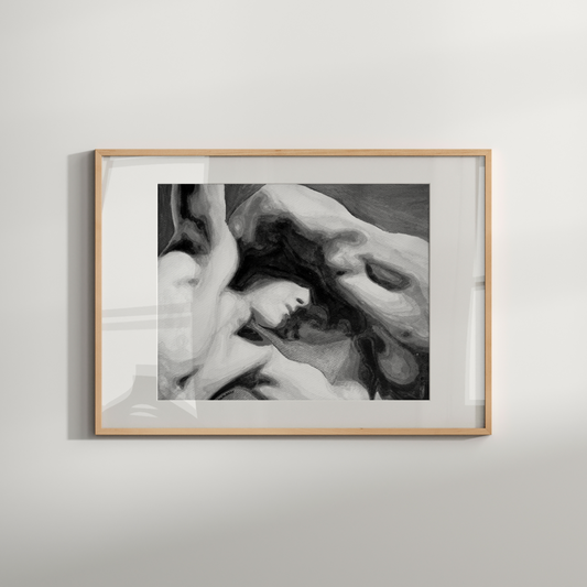 Framed black and white artwork of a classical sculpture on a light gray wall