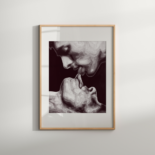 Framed artwork of a face and hand on a white wall