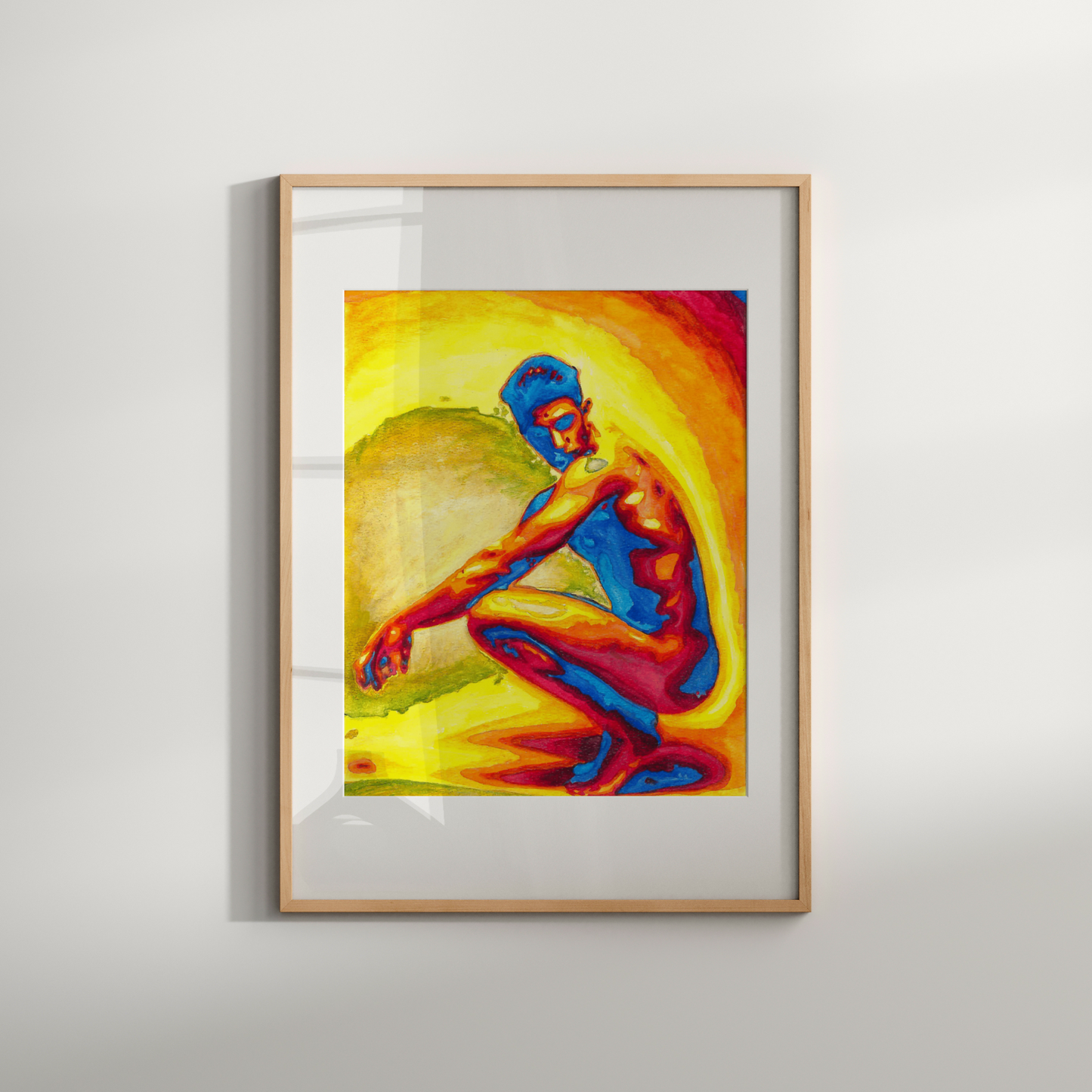 Framed colorful artwork of a seated figure on a white wall