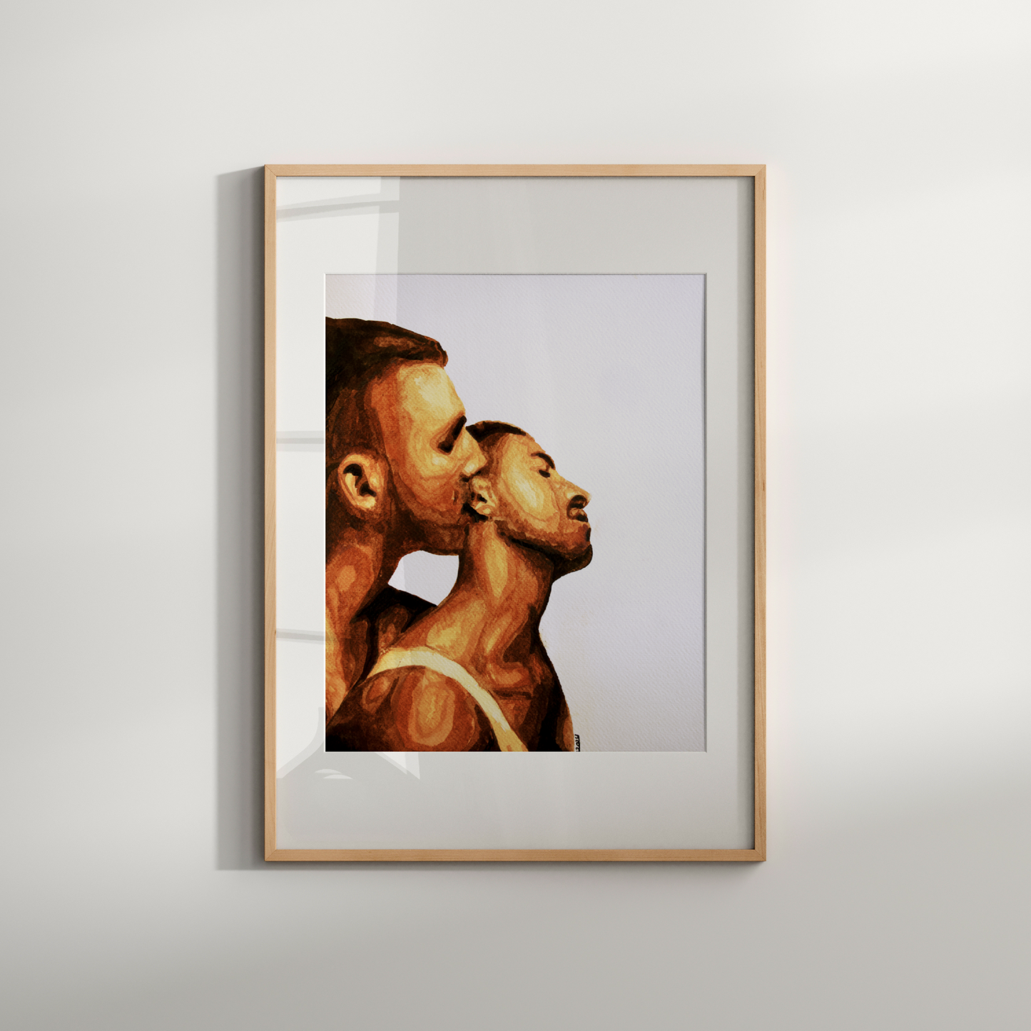 Framed artwork of two profiles on a white wall