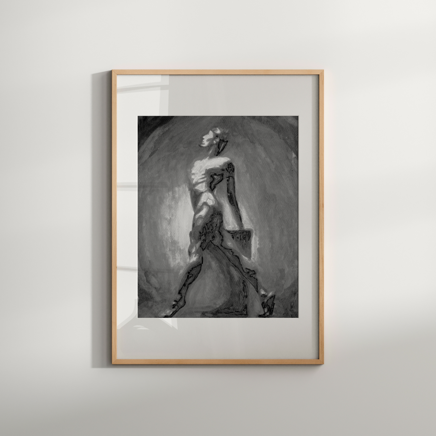 Framed black and white artwork of a woman in a dress on a light gray wall.