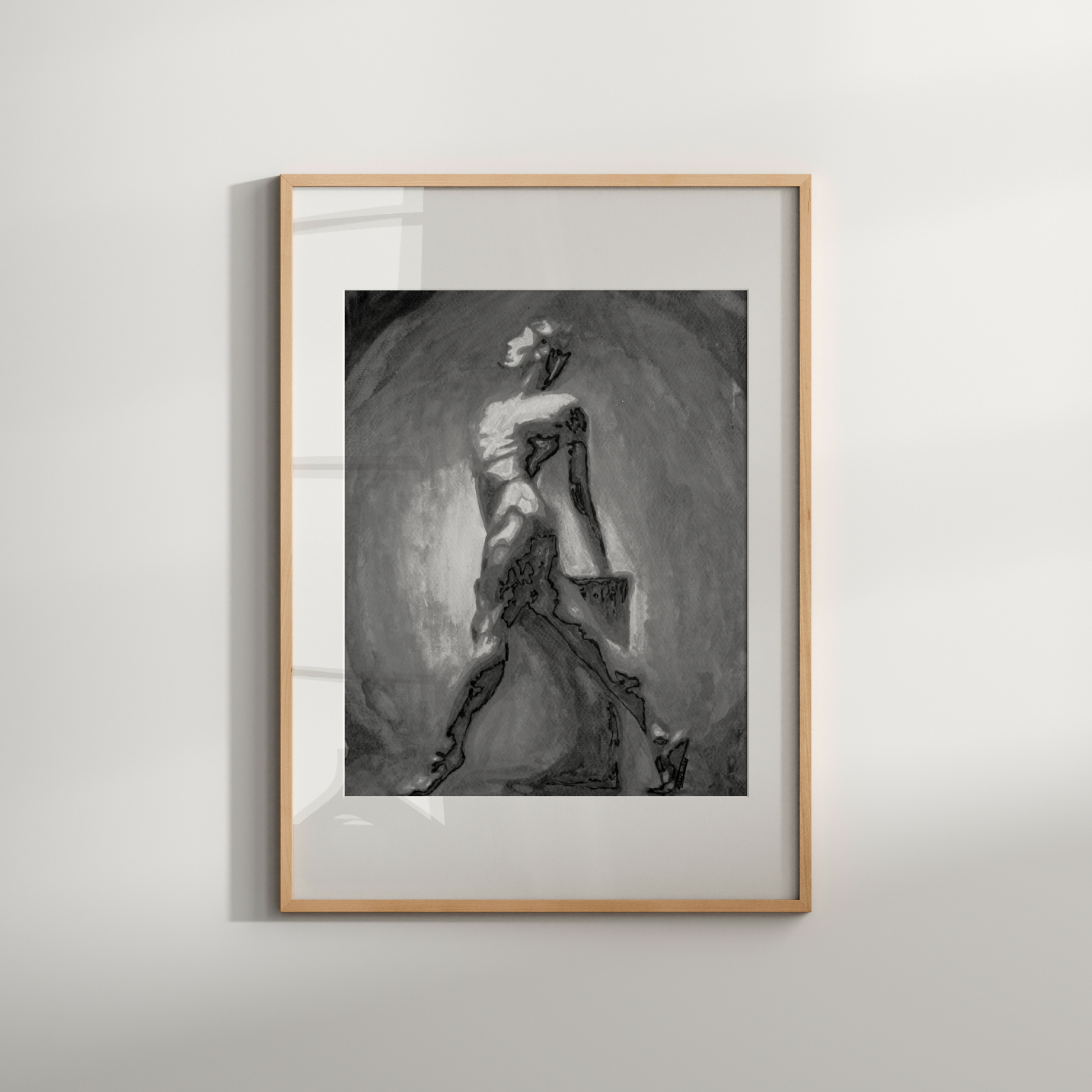 Framed black and white artwork of a woman in a dress on a light gray wall.