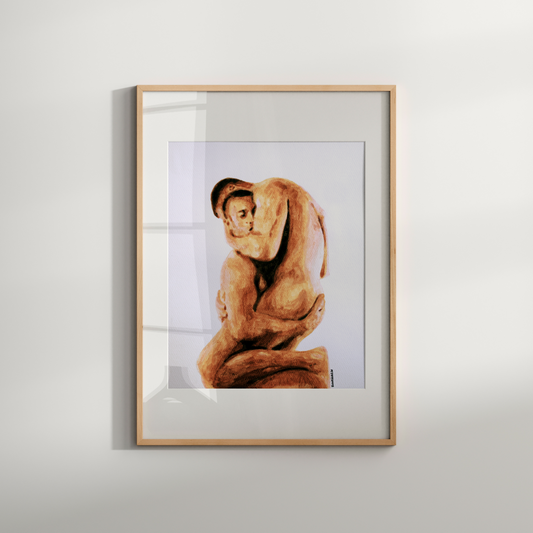 Framed artwork of a person in a sitting pose on a white wall