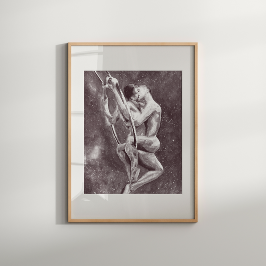 Framed black and white artwork of two figures on a plain wall